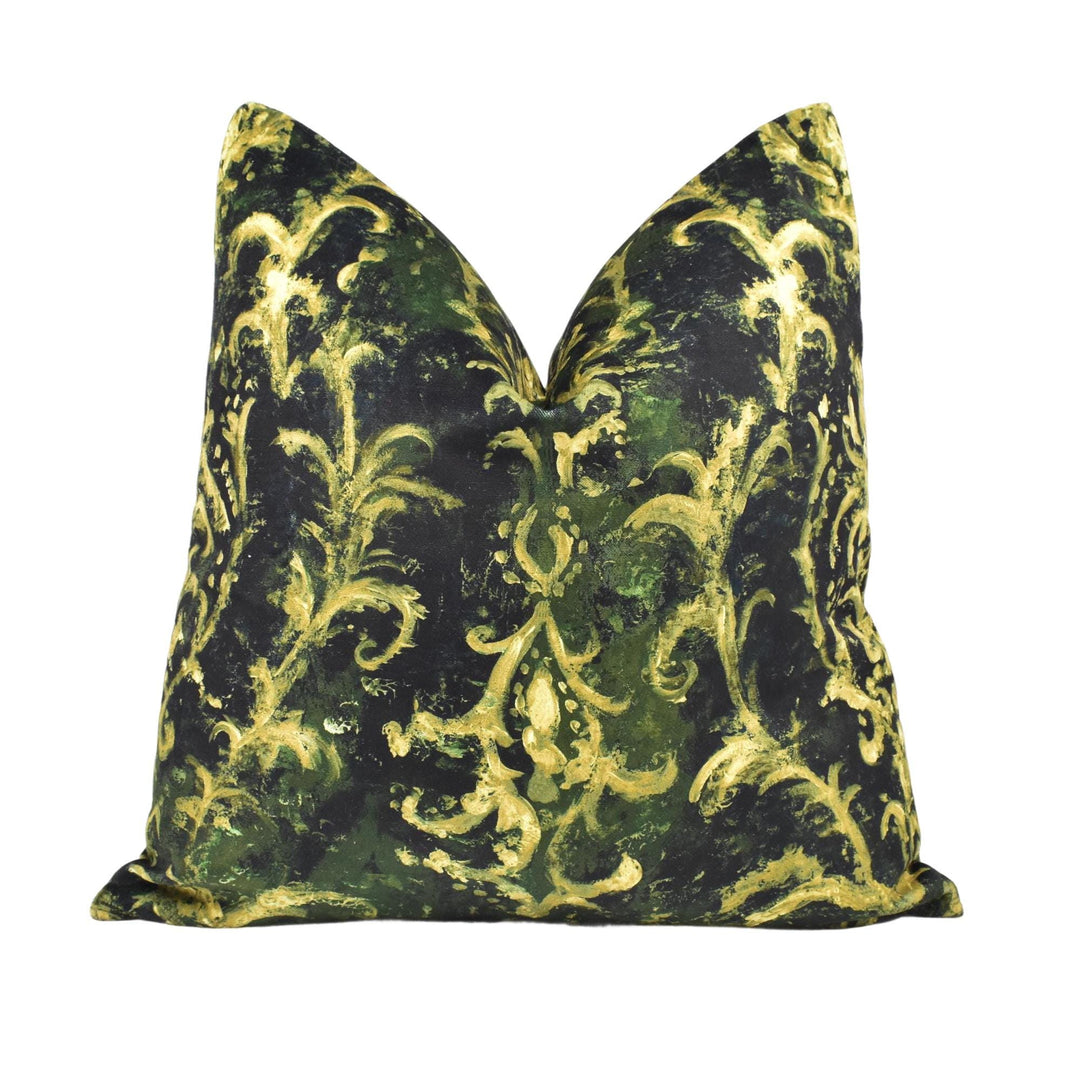 a decorative pillow with a black and gold floral pattern.
