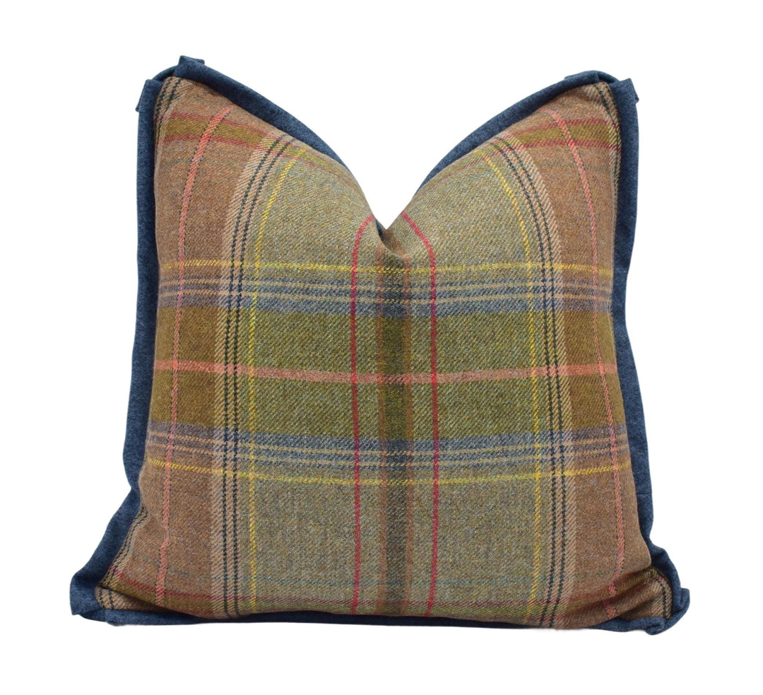 a plaid pillow on a white background