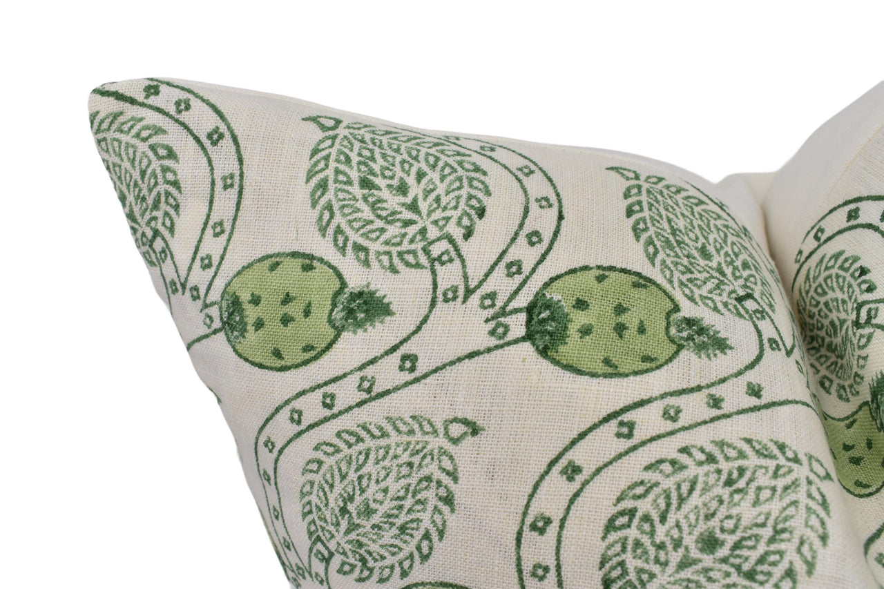 a close up of a green and white pillow