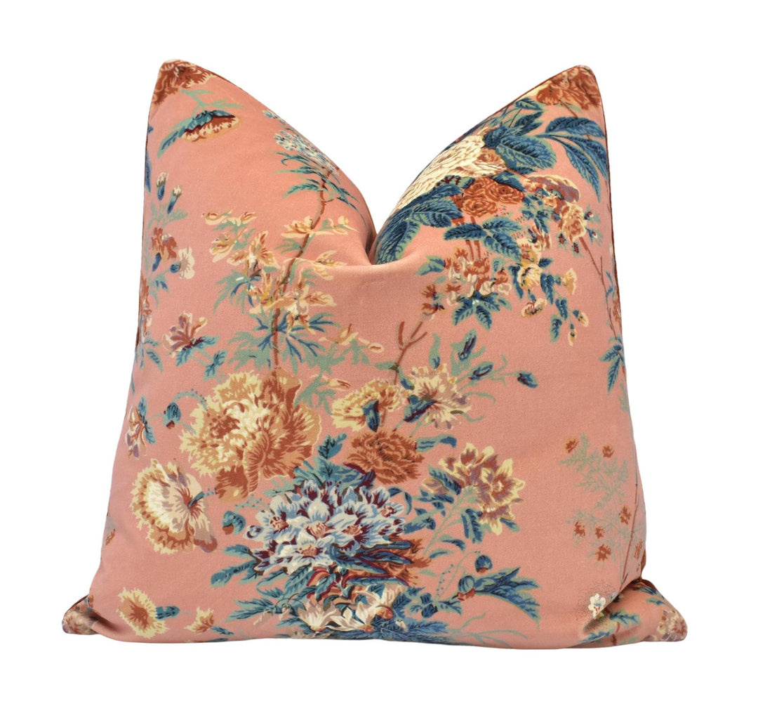a pink pillow with a floral pattern on it
