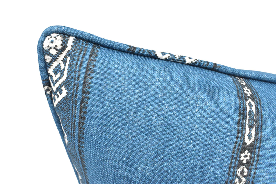 a close up of a blue pillow with a pattern on it