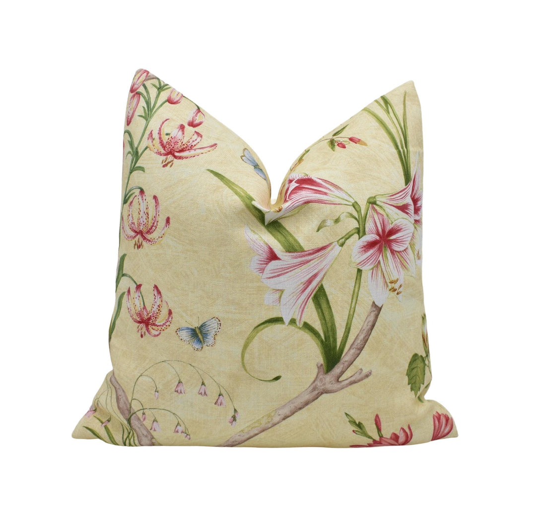 a white pillow with pink flowers on it