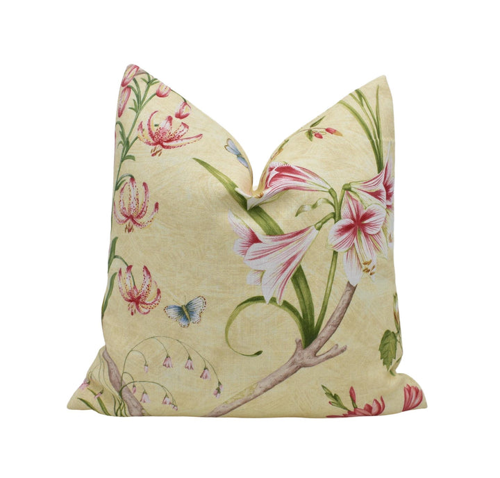 a white pillow with pink flowers on it