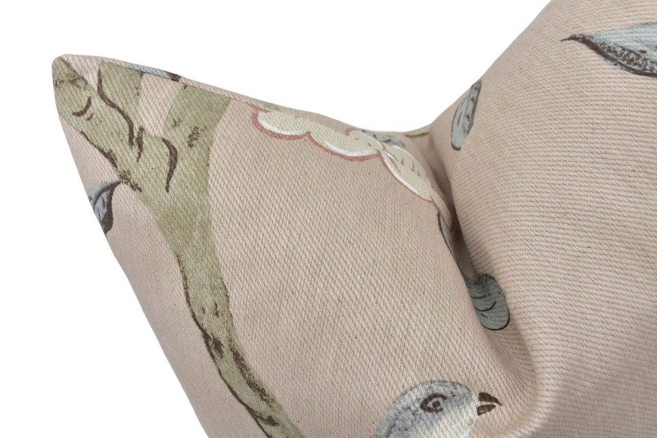 a close up of a pillow with birds on it