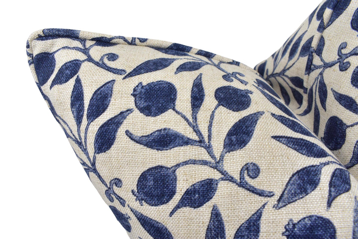a close up of a blue and white pillow on a white background