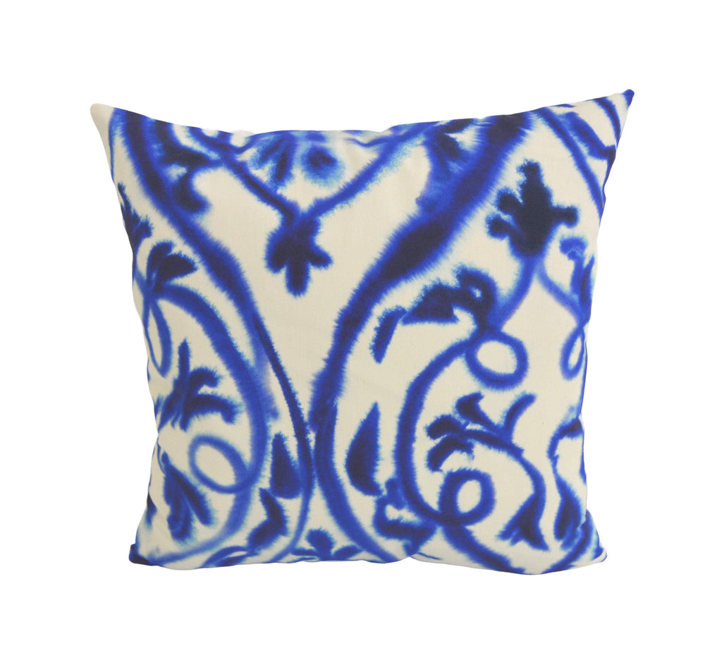 a blue and white pillow on a white background