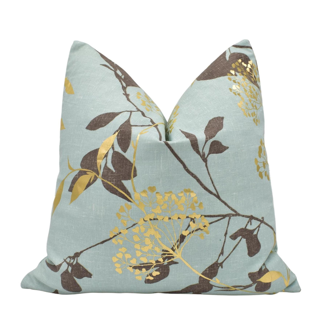 a blue pillow with a gold leaf design on it