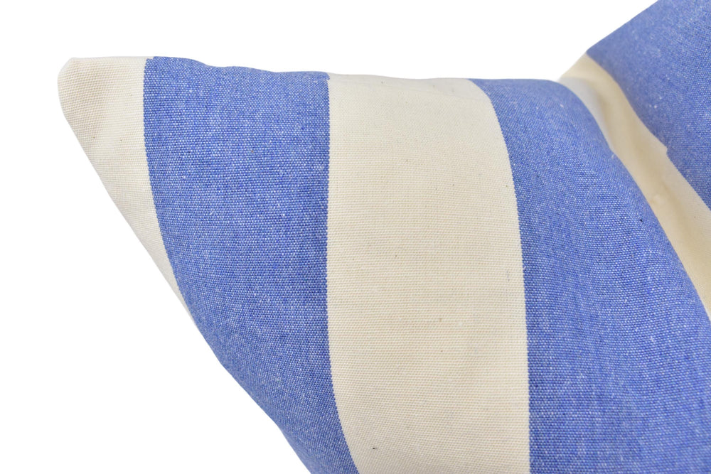 a blue and white striped pillow on a white background