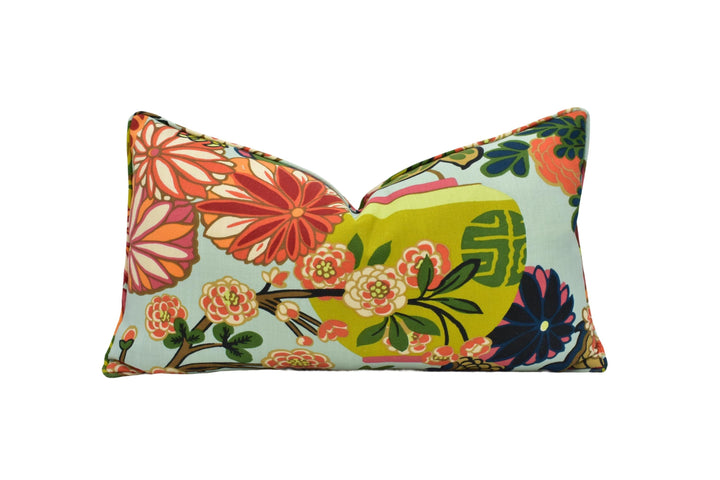 a pillow with a colorful flower design on it