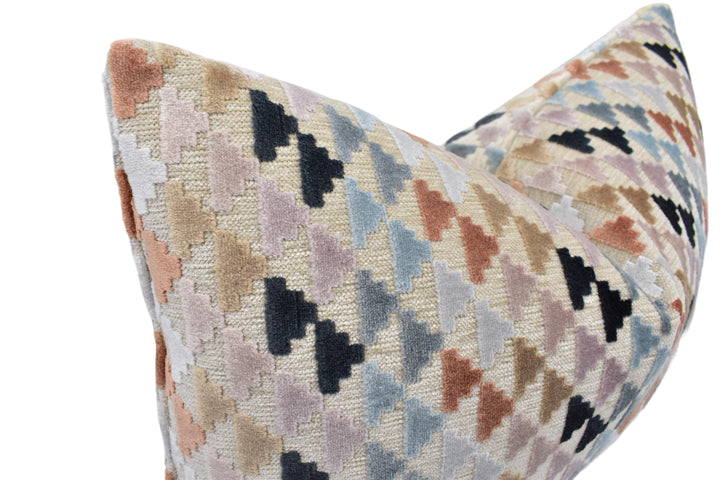 a multicolored pillow on a white background