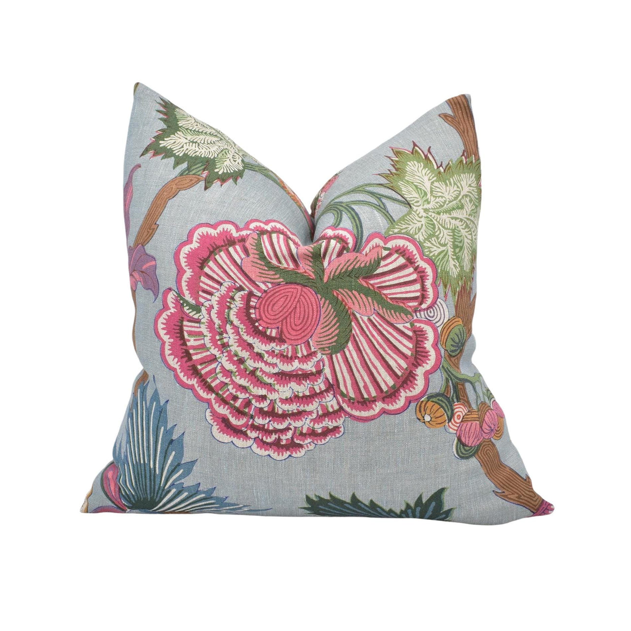 a blue pillow with a pink flower on it