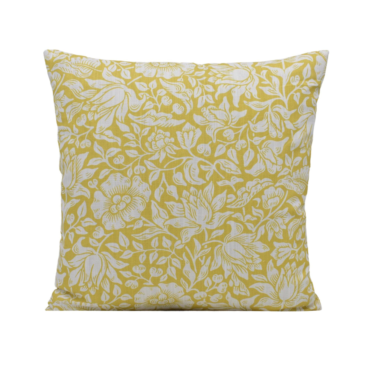 a yellow pillow with white flowers on it