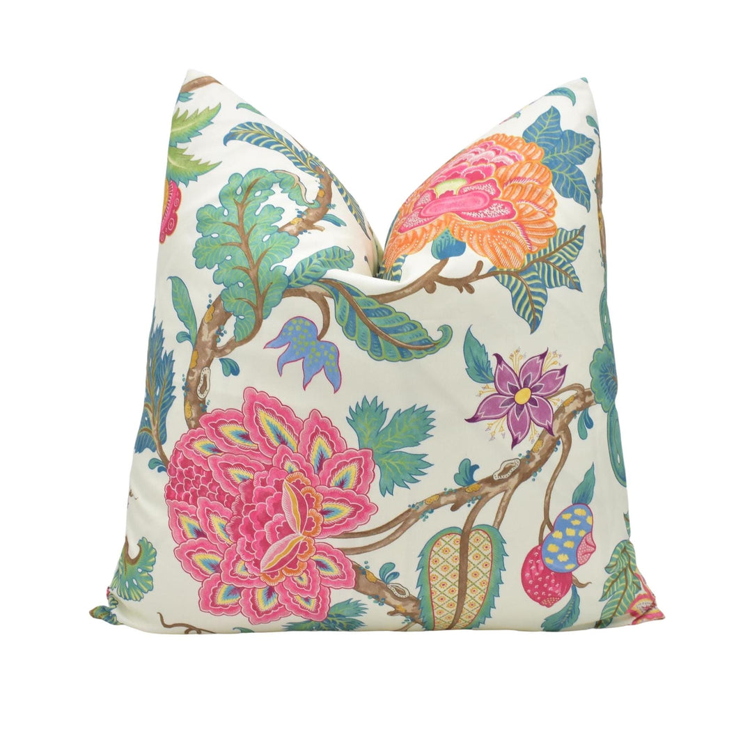 a white pillow with colorful flowers on it