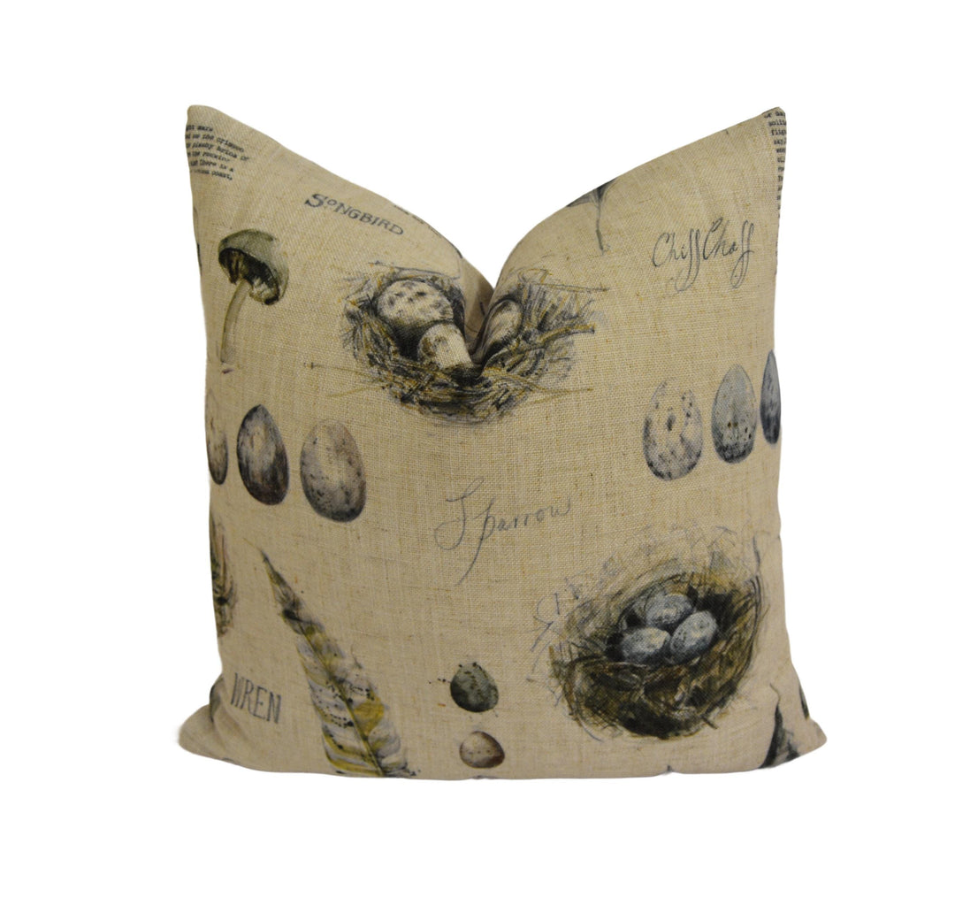 a pillow with a bird&#39;s nest on it