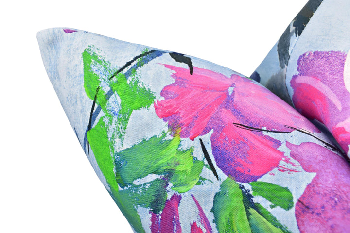 a close up of a pillow with flowers on it