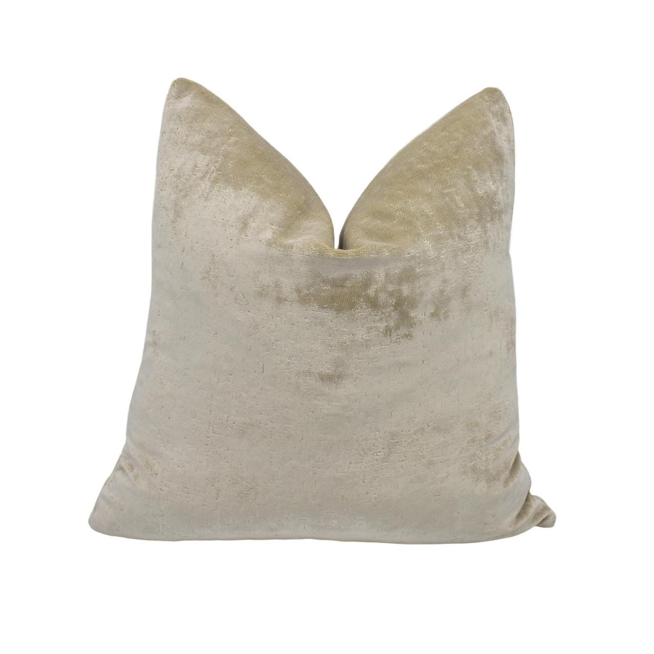 a beige velvet pillow with a large pillow on top of it