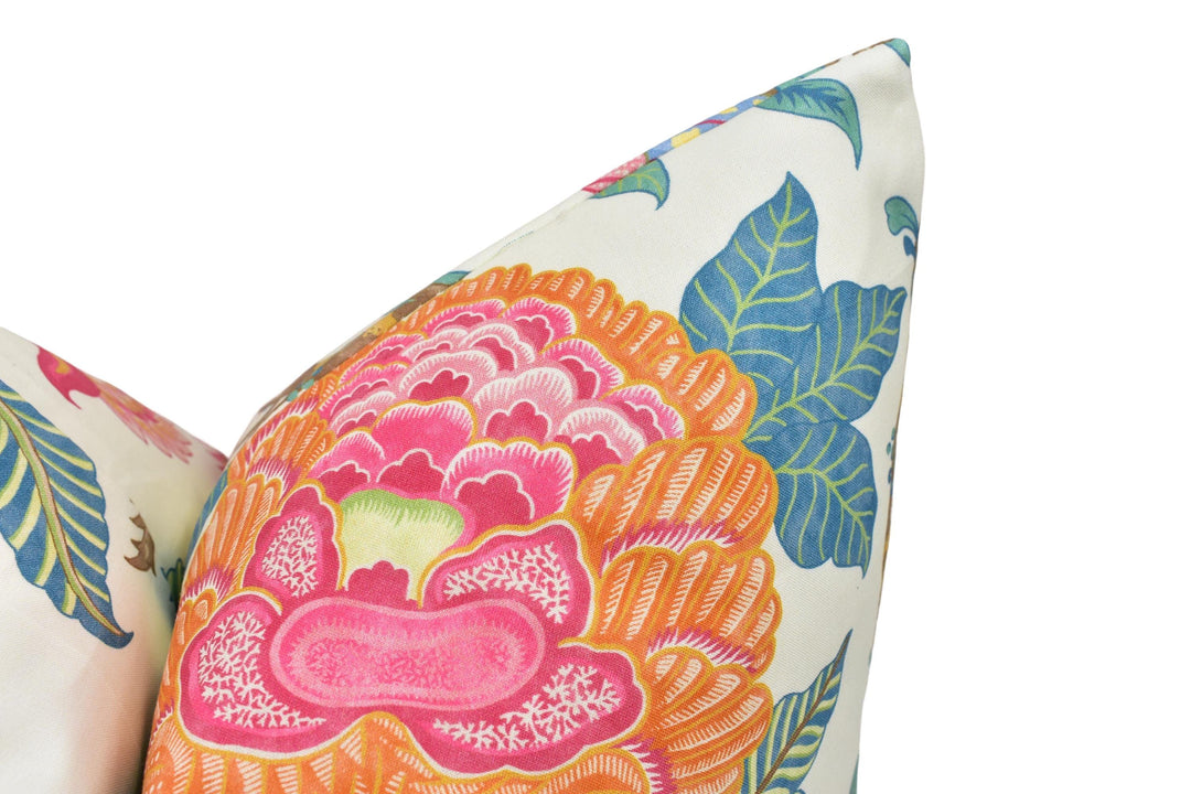 a close up of a pillow with a flower design on it