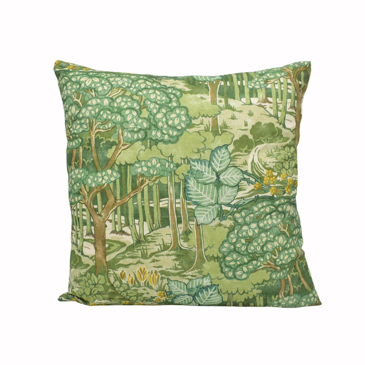 a green pillow with a forest scene on it