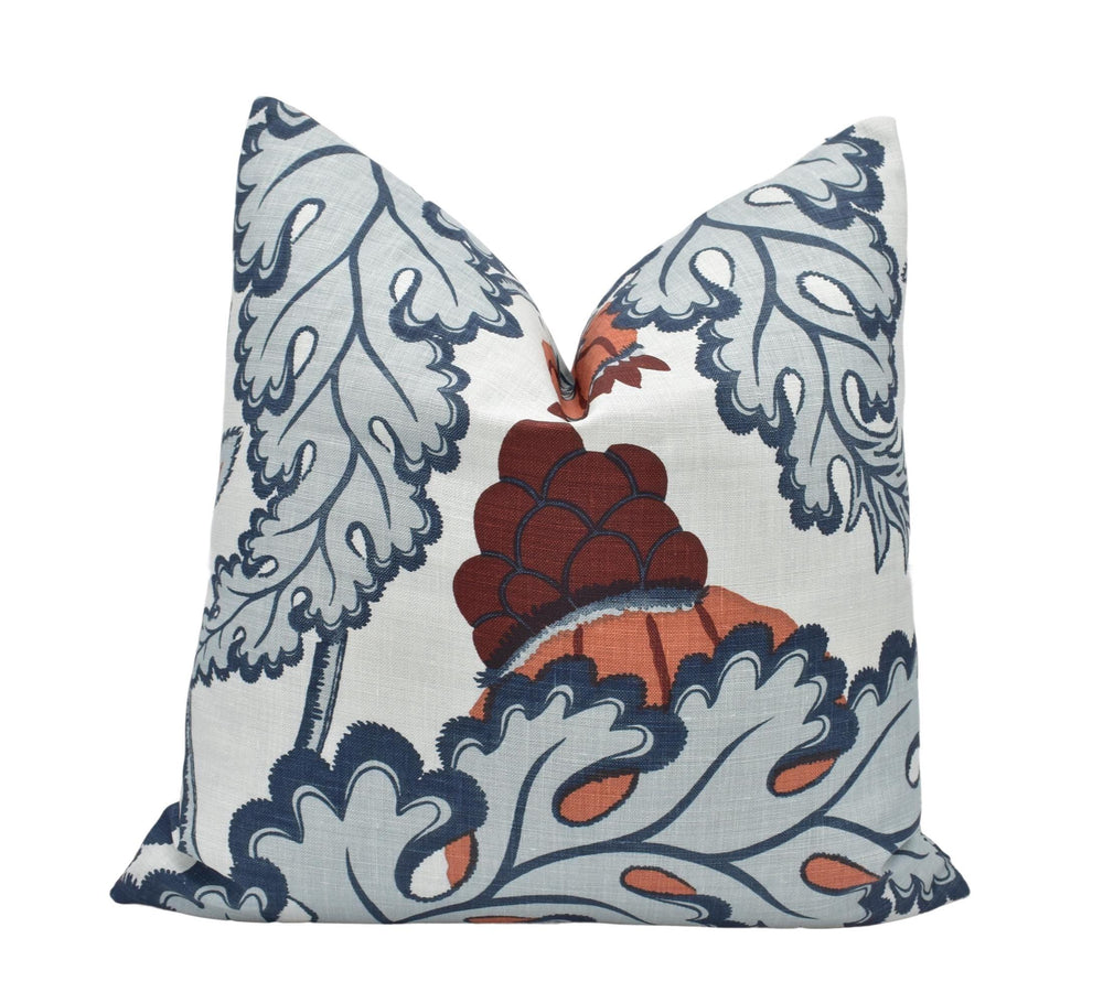 a decorative pillow with an orange and blue design