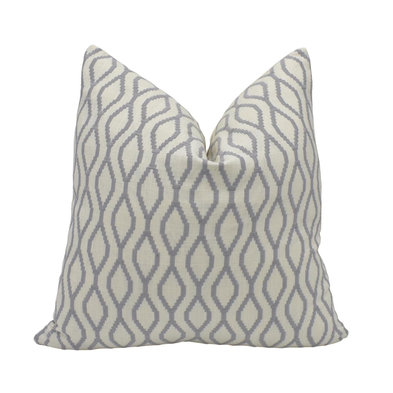 a grey and white pillow with a diamond pattern