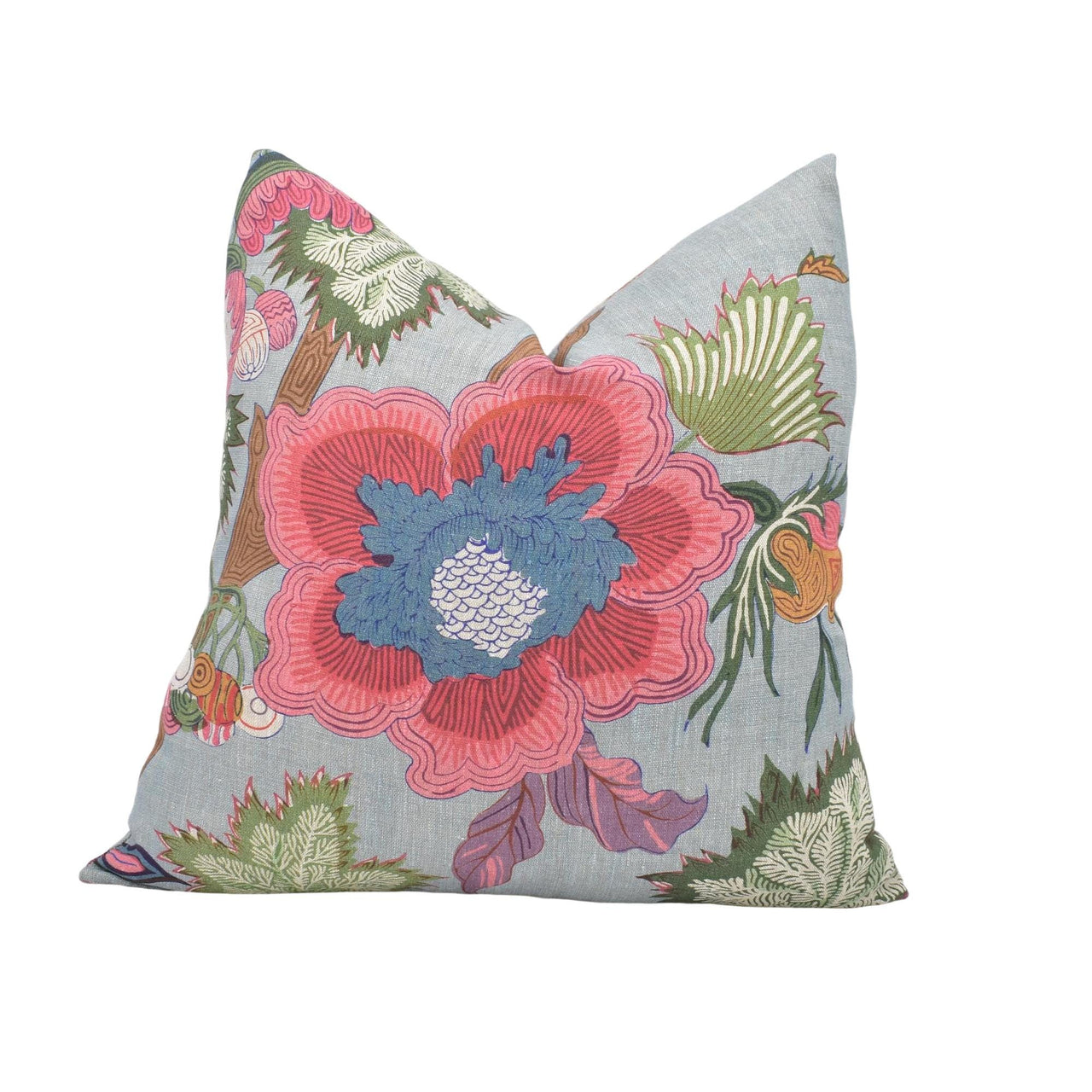 a blue pillow with a pink flower on it