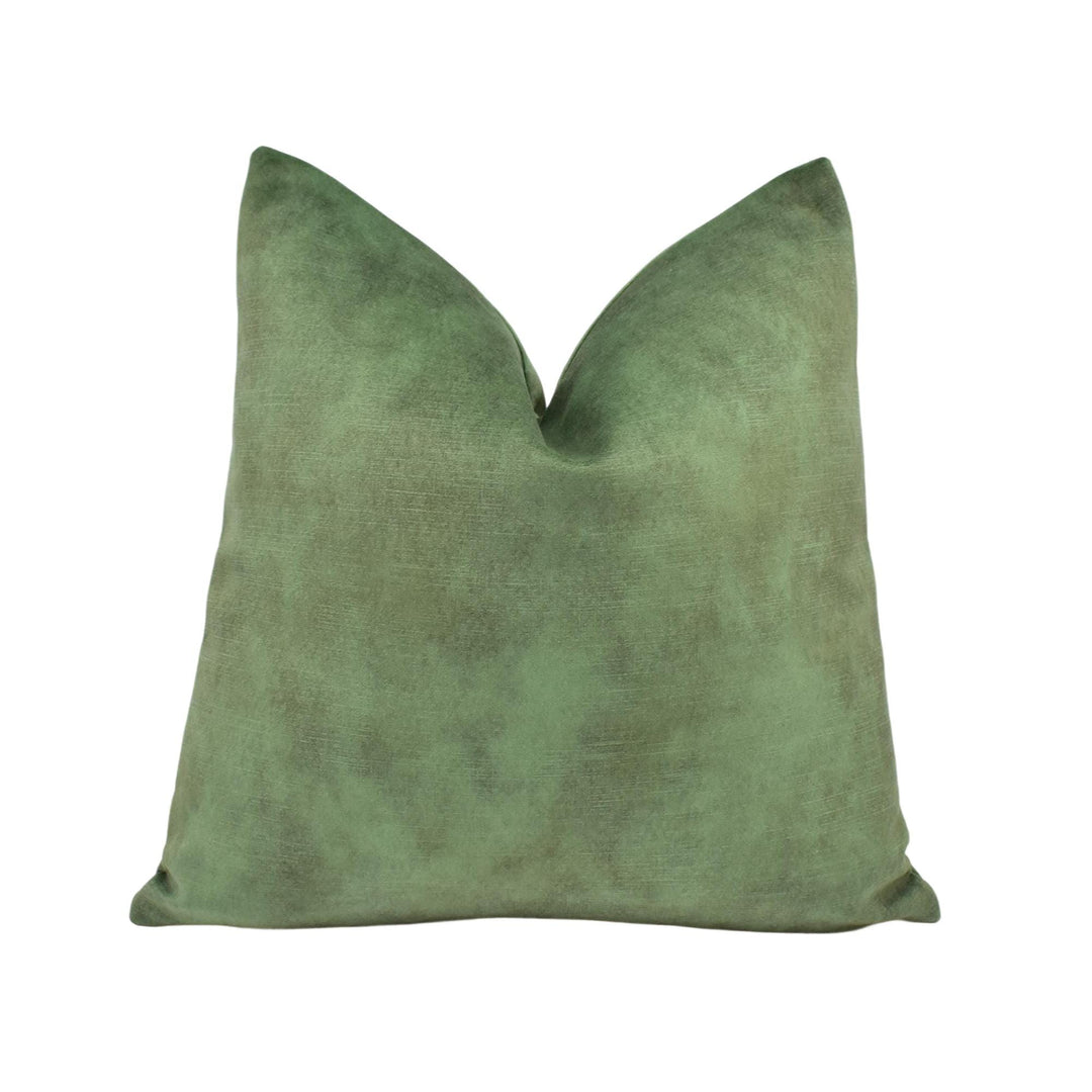 A single, green, textured pillow is shown against a white background.