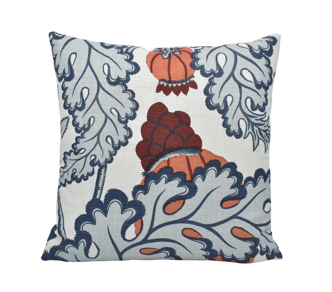 a blue and orange pillow with a heart on it