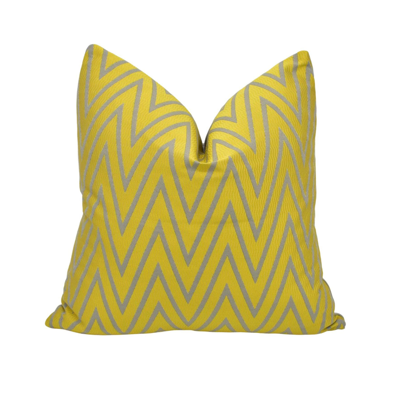 a yellow and grey pillow on a white background