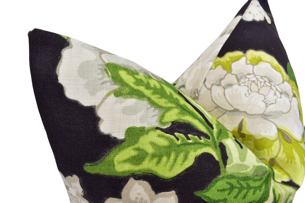 a close up of a pillow with a flower on it
