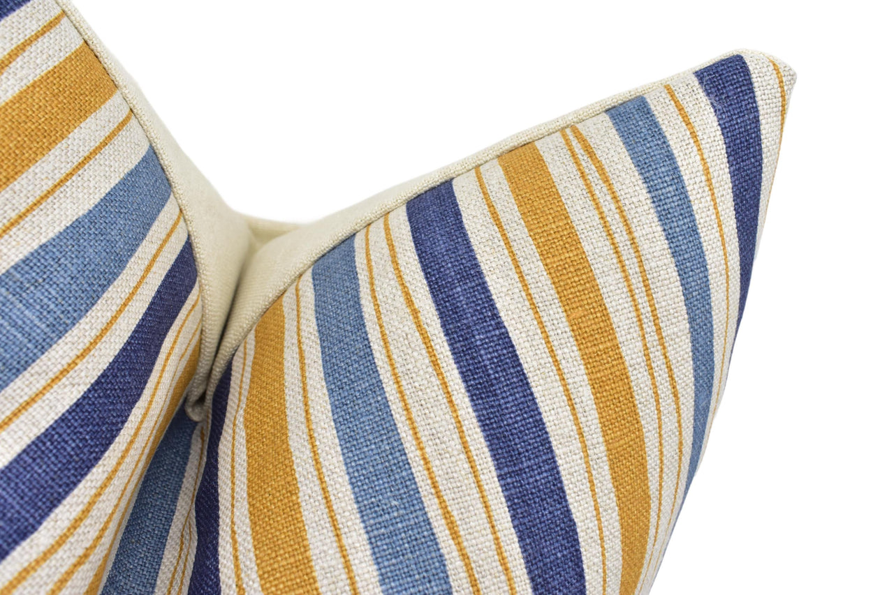 a close up of a blue and yellow striped bow tie