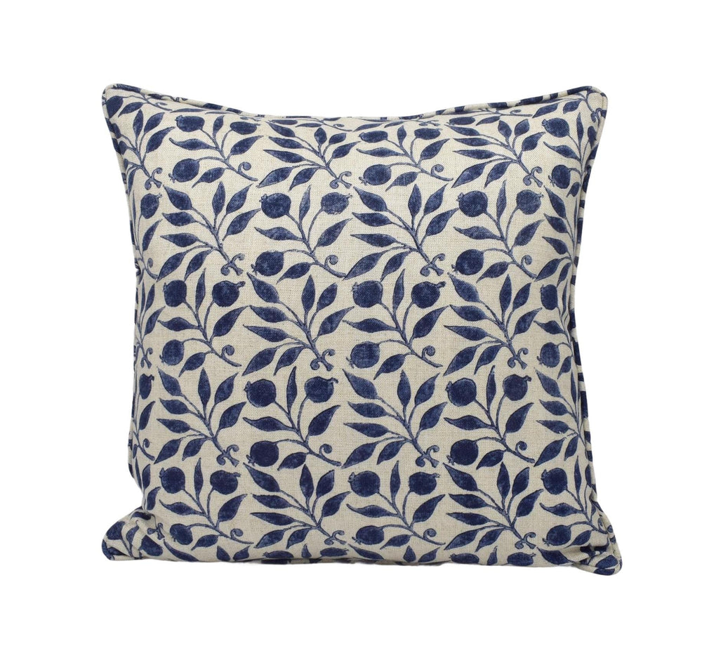 a blue and white pillow on a white background