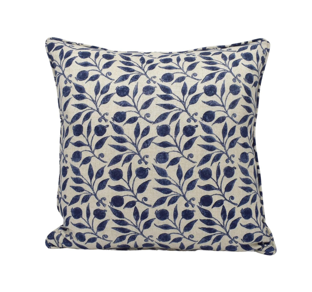 a blue and white pillow on a white background
