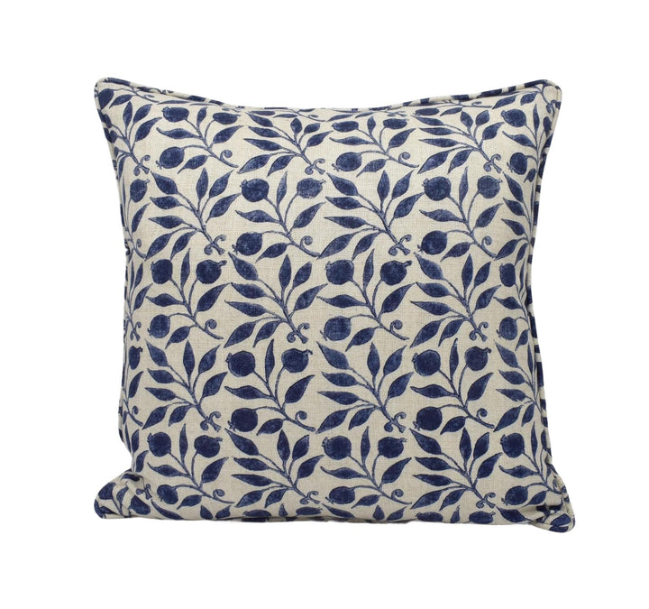 a blue and white pillow on a white background