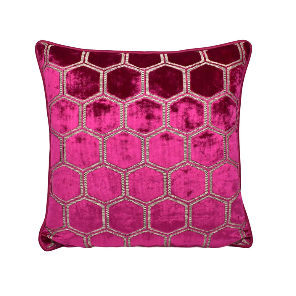 a pink and gold cushion with a hexagonal pattern