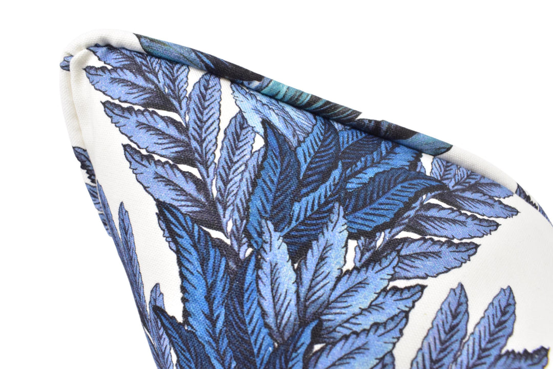 a close up of a tie with blue leaves on it