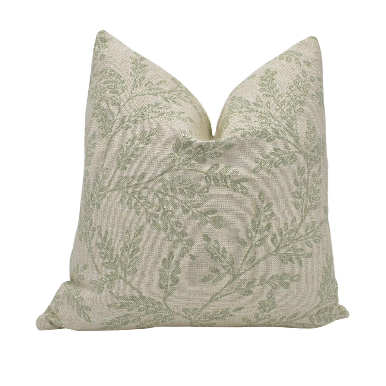 a green and white pillow on a white background