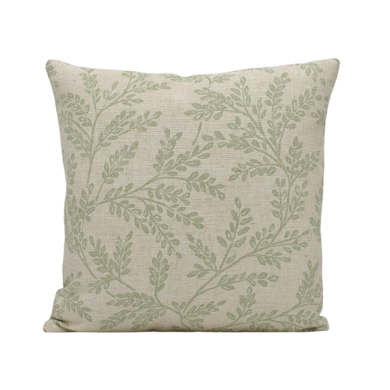 a green and white pillow with leaves on it