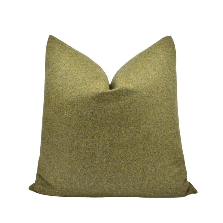 A single, square throw pillow with a textured, green fabric.