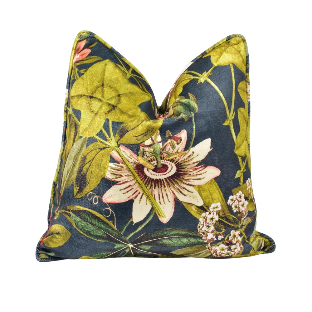 a blue and yellow pillow with a flower on it