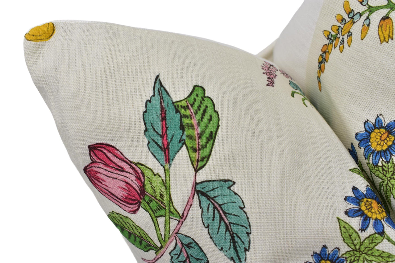 a close up of a pillow with flowers on it