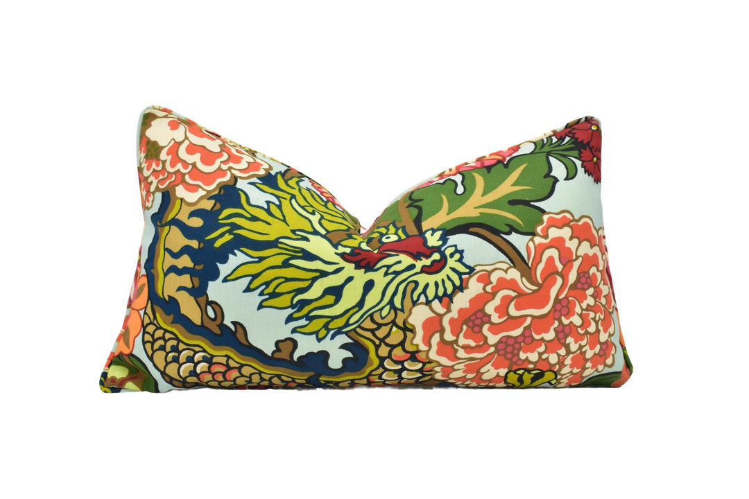 a colorful pillow with a flower design on it