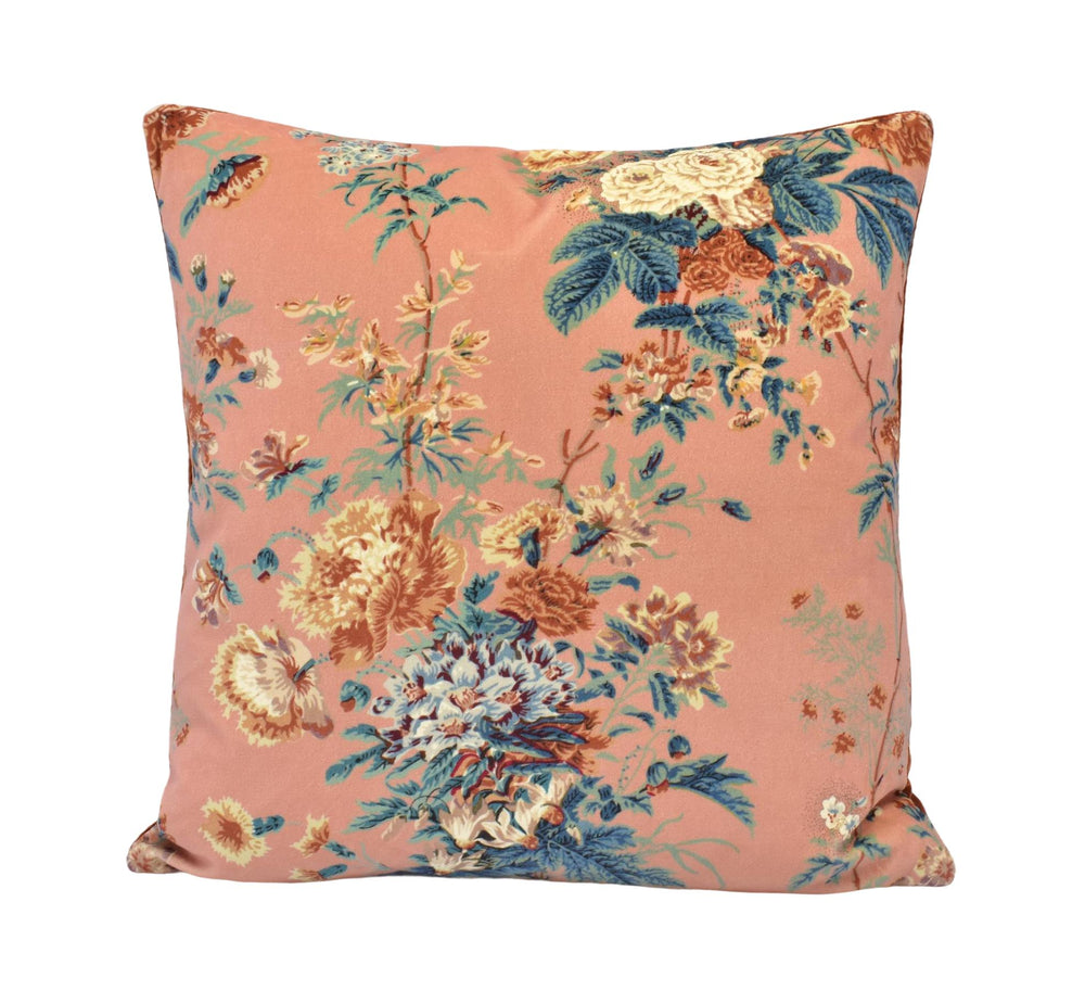 a pink pillow with a floral pattern on it