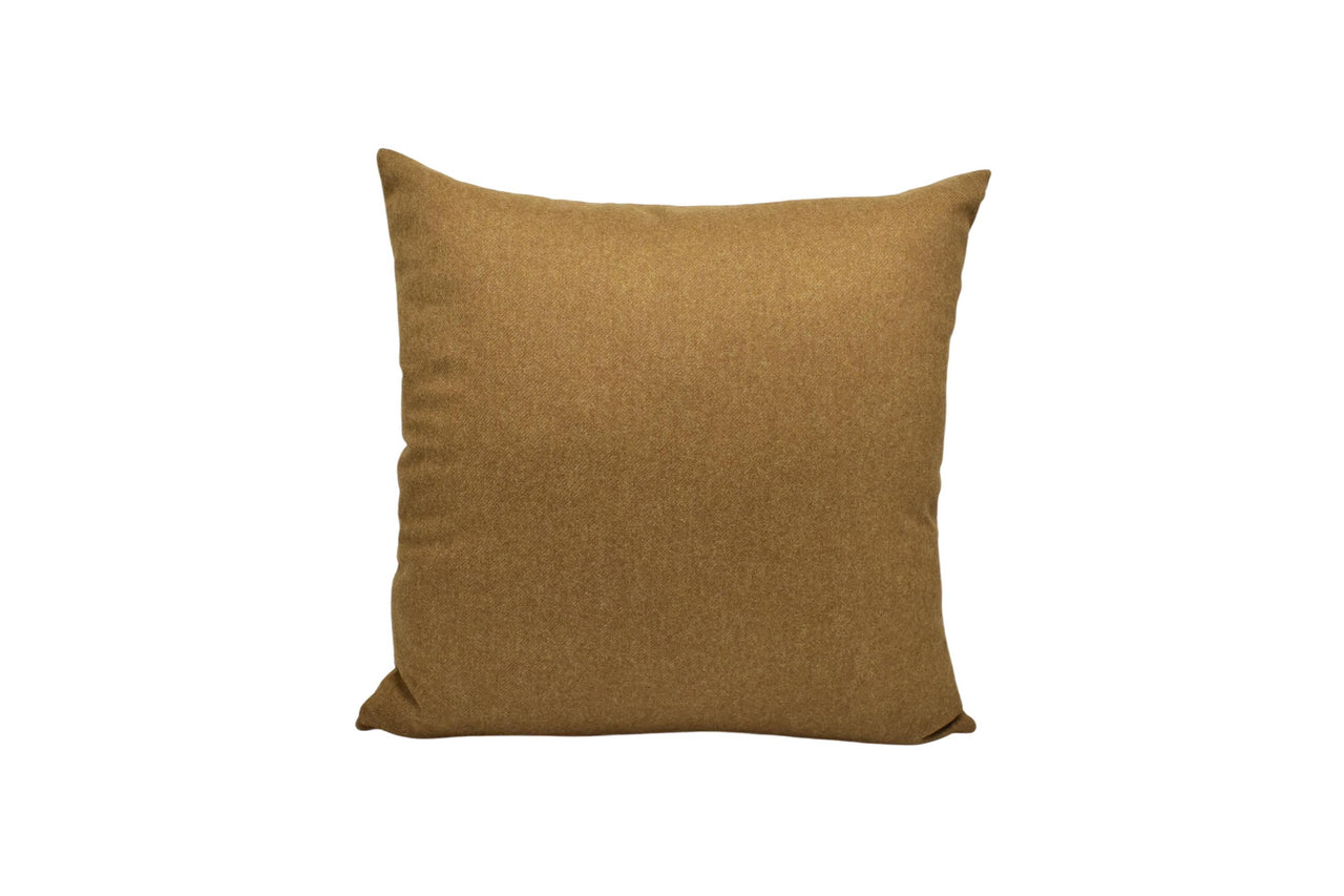 a brown pillow on a white background