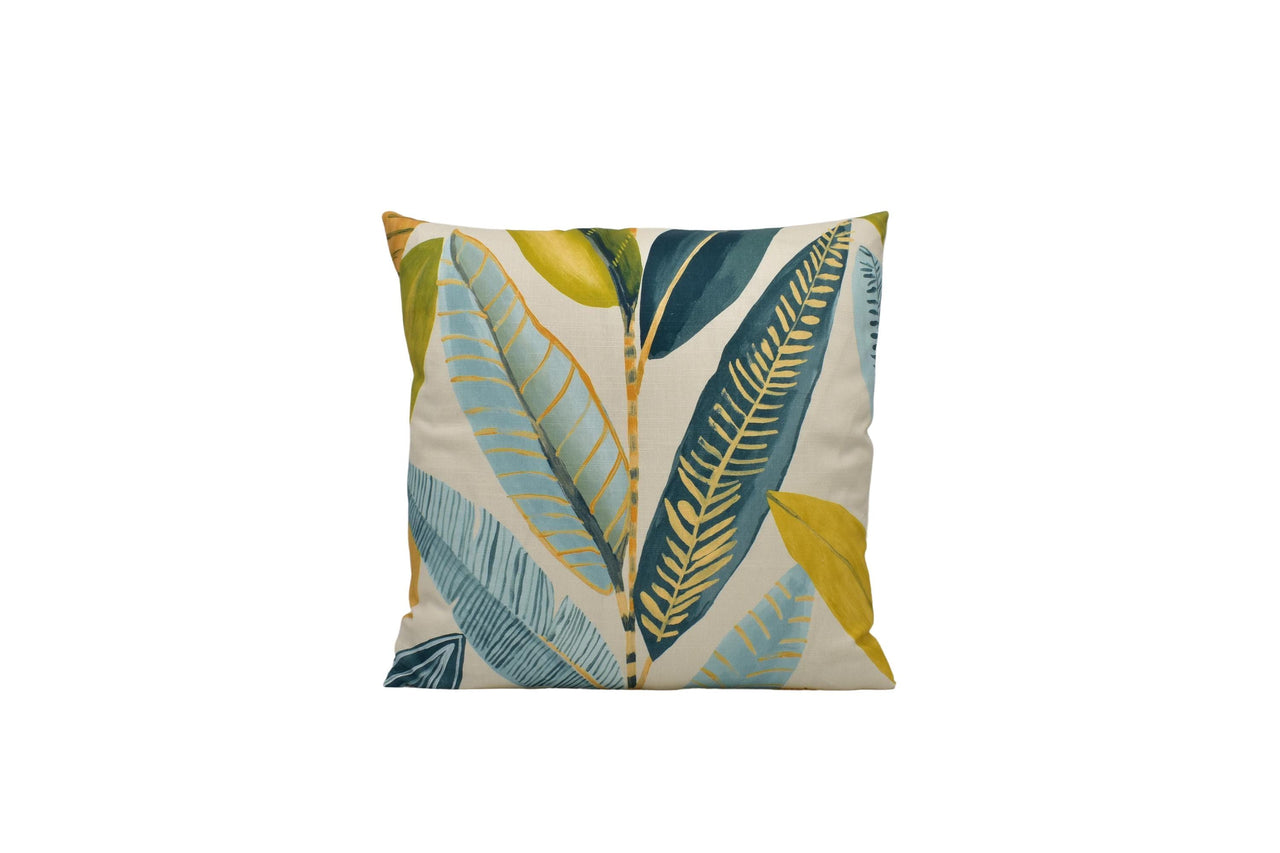 a pillow with a blue and green leaf pattern