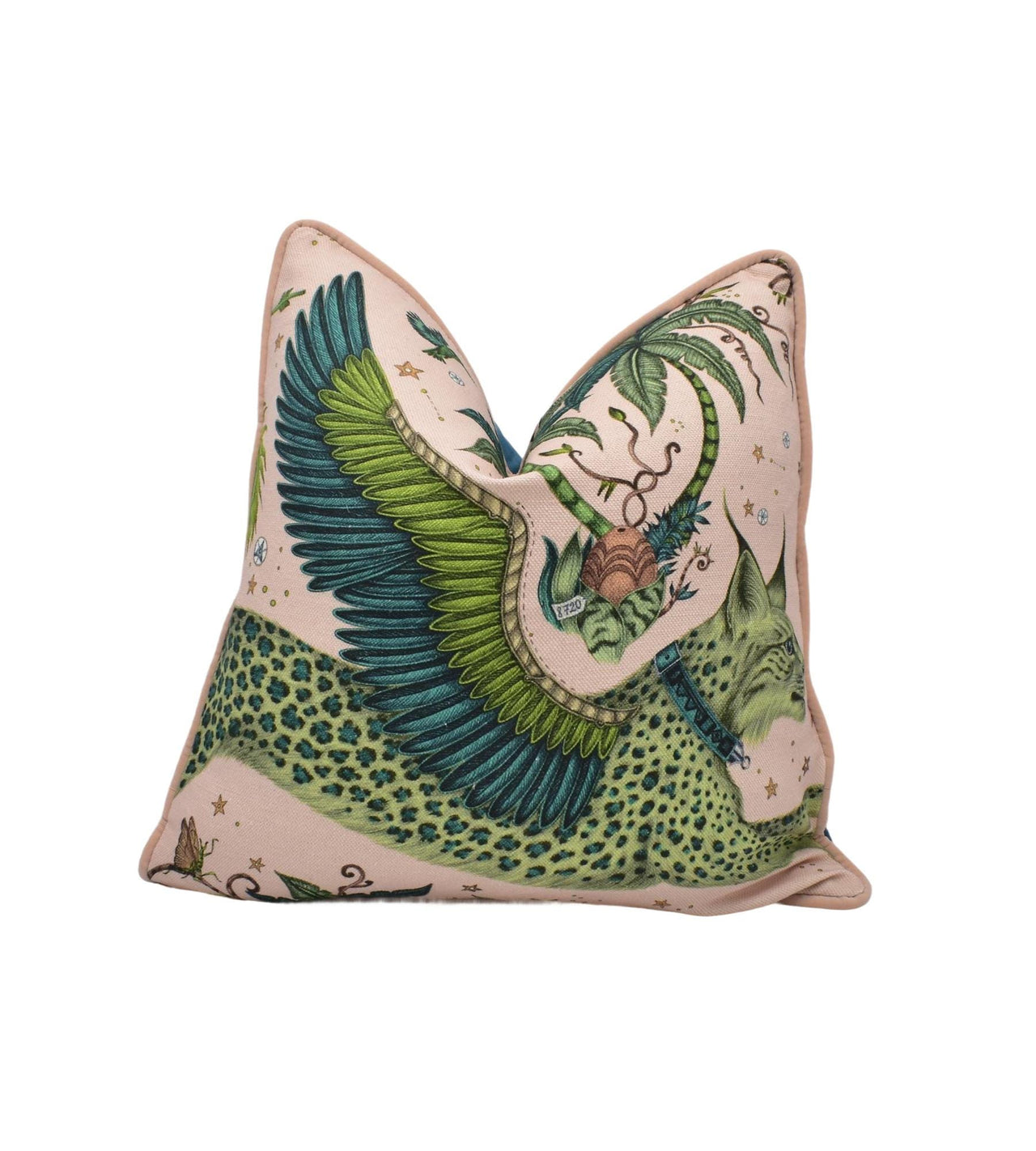 a green and white pillow with a dragon on it