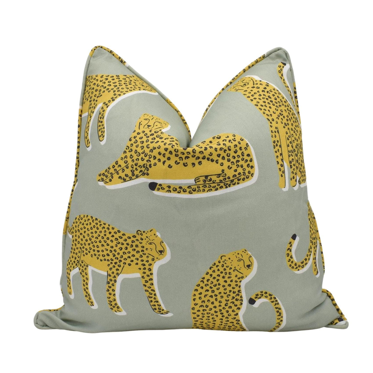 a yellow and gray pillow with cheetah and leopards on it