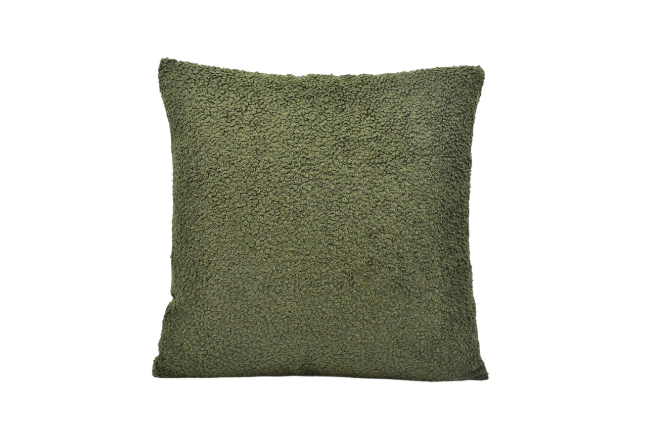 a green pillow on a white background