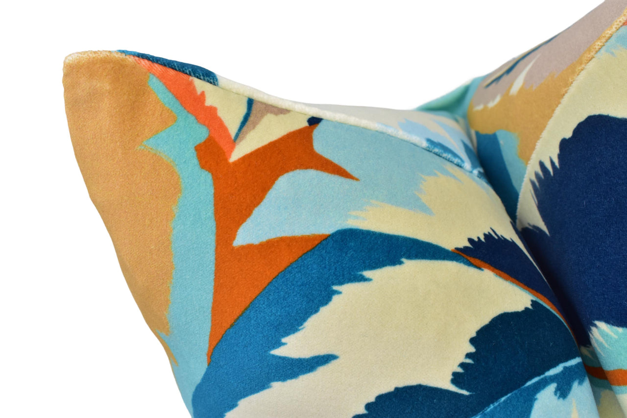 a close up of a colorful pillow on a white background