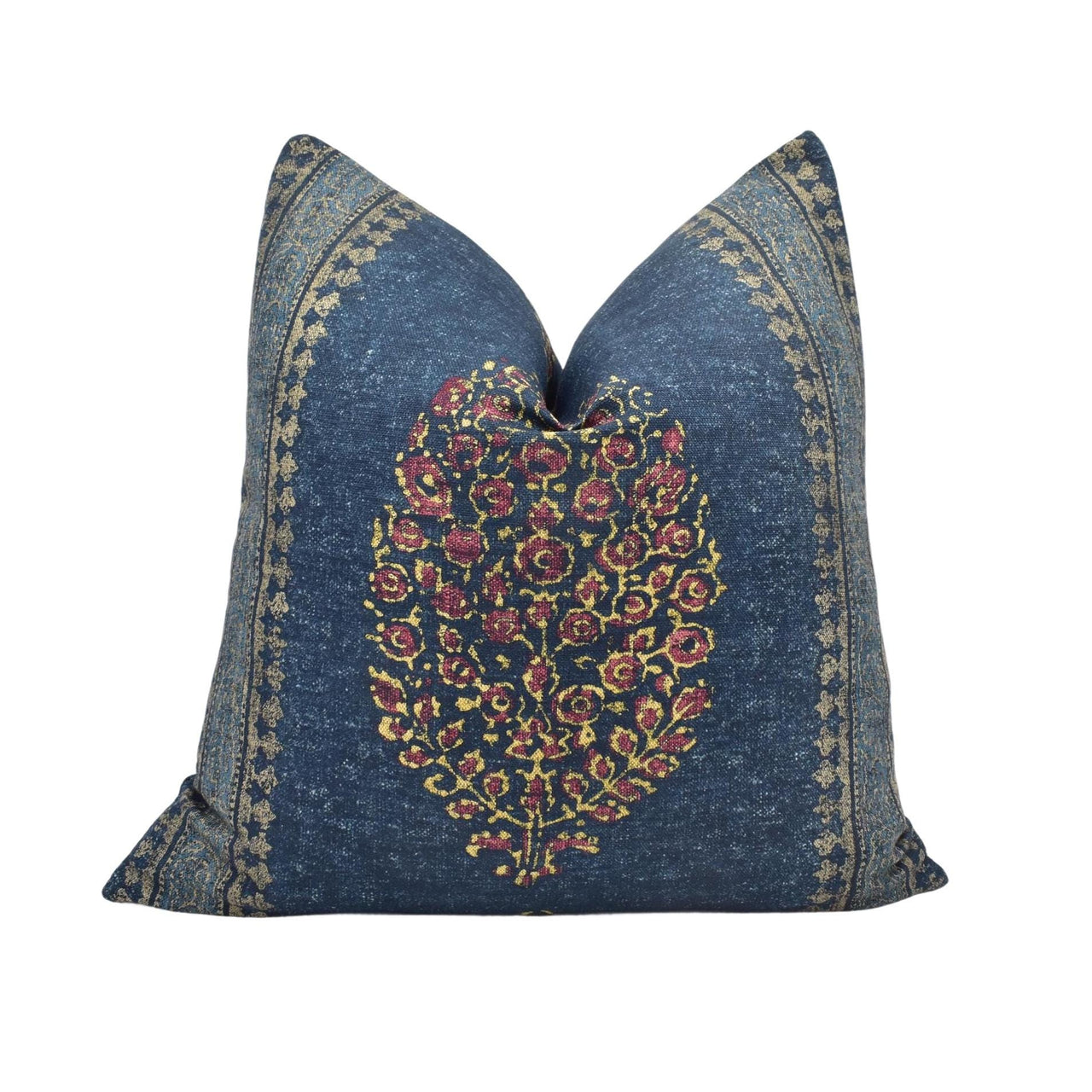 a blue pillow with a floral design on it