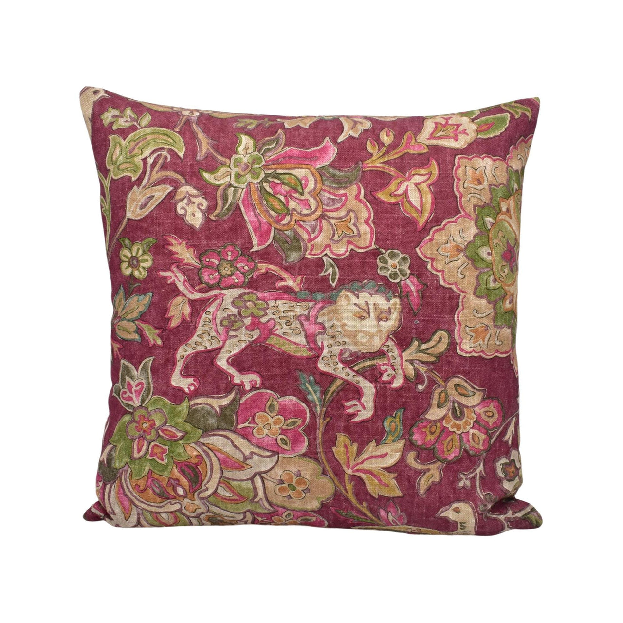 a red pillow with a floral design on it